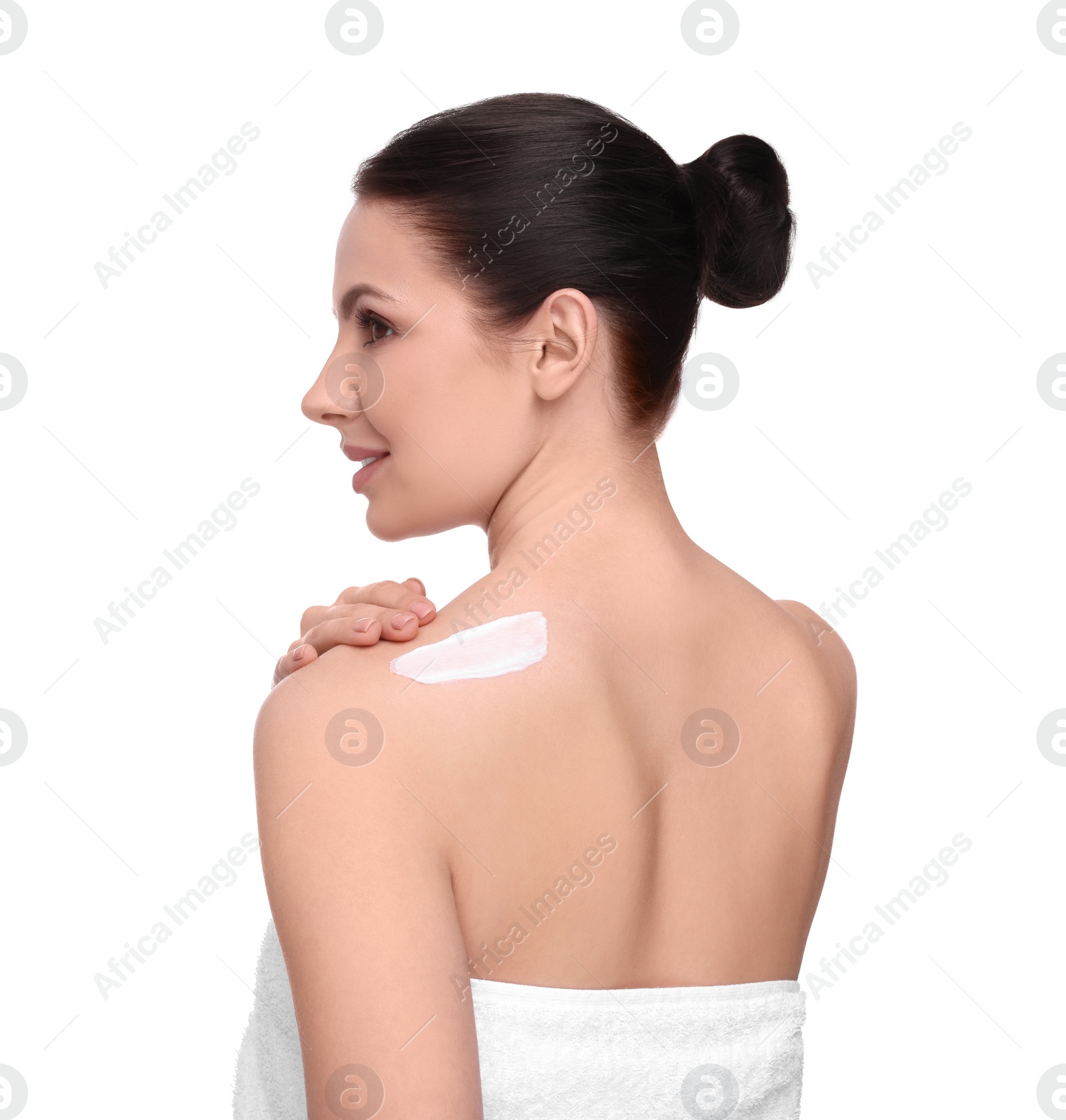 Photo of Beautiful woman with smear of body cream on her shoulder against white background