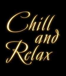 Glowing neon sign with phrase Chill And Relax on black background