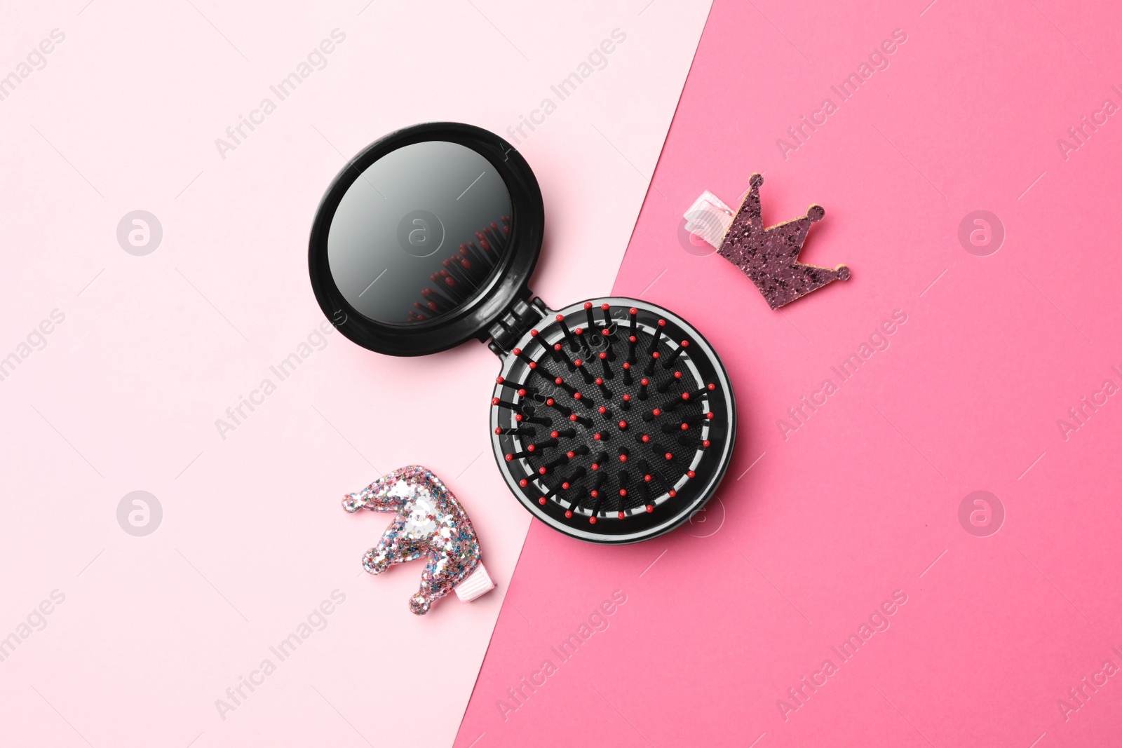 Photo of Flat lay composition with modern round folding hair brush on color background