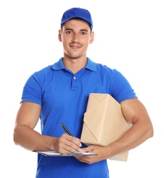 Photo of Happy young courier with parcel and clipboard on white background