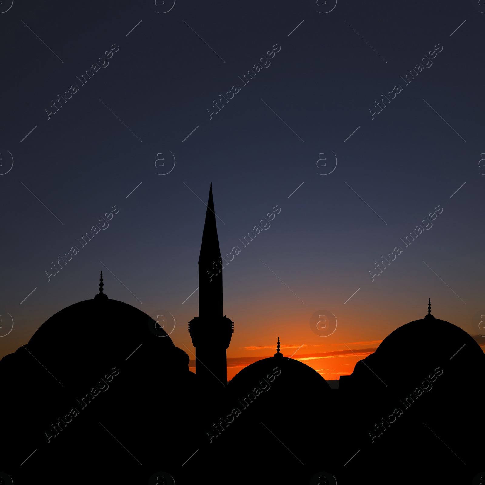 Image of Silhouette of mosque during sunset. Muslim culture