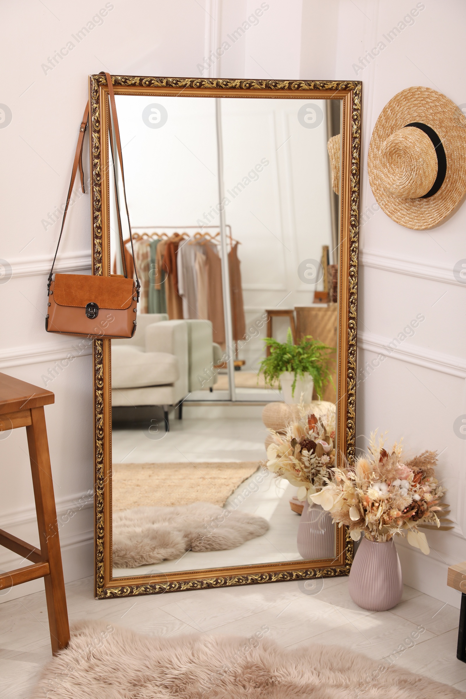 Photo of Large mirror and accessories in dressing room. Interior design