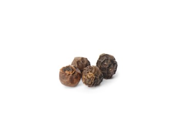 Black peppercorns isolated on white. Aromatic spice