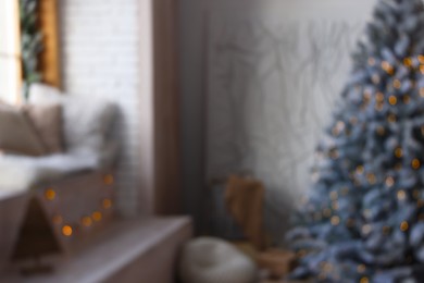 Blurred view of room with Christmas tree and festive decor
