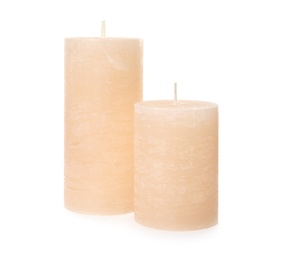 Two color wax candles on white background