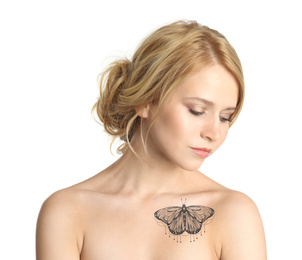 Young woman with beautiful tattoo of butterfly on her body against white background