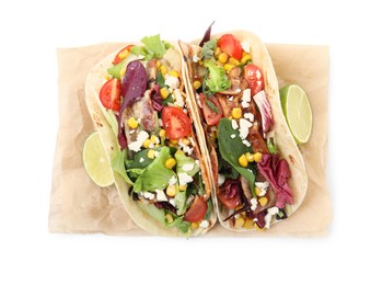 Delicious tacos with fried bacon and lime on white background, top view
