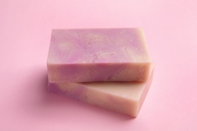 Hand made soap bars on color background