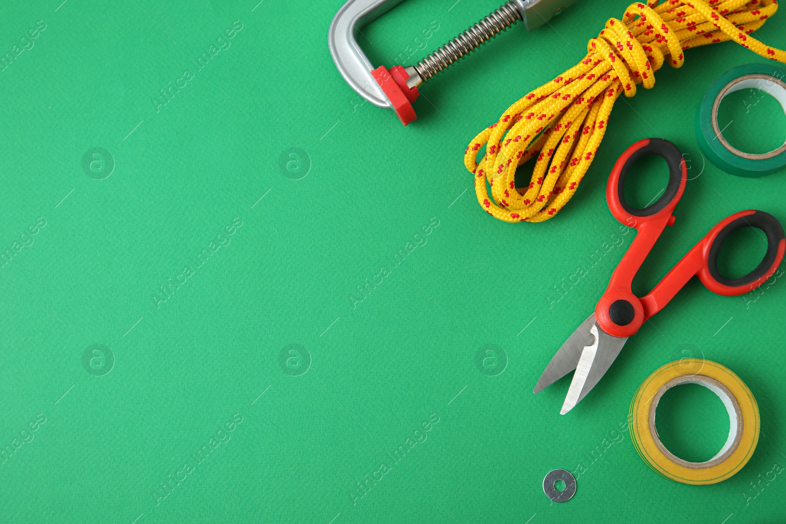 Photo of Set of repair tools on green background, flat lay. Space for text