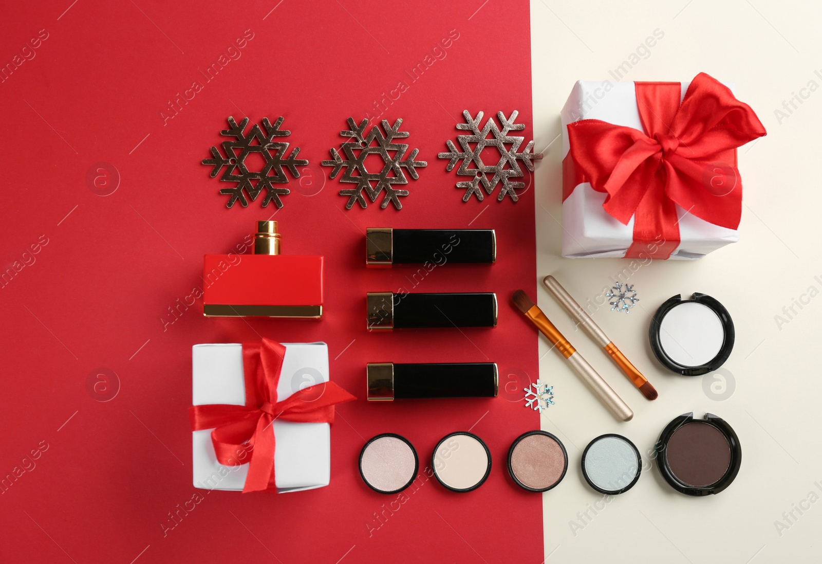 Photo of Flat lay composition with decorative cosmetic products on color background. Winter care