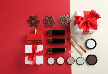 Photo of Flat lay composition with decorative cosmetic products on color background. Winter care