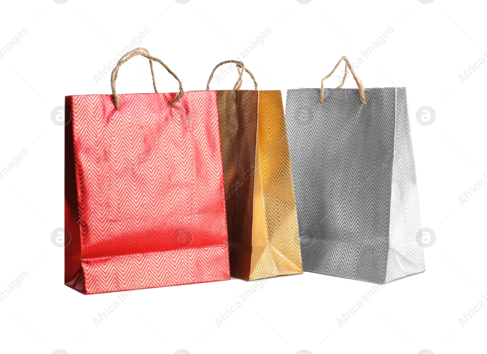 Photo of Color paper shopping bags isolated on white. Space for design