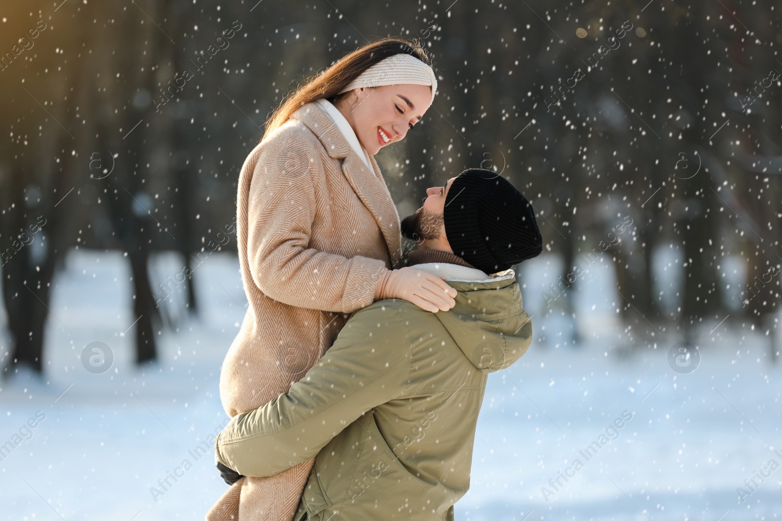 Photo of Beautiful young couple enjoying winter day outdoors