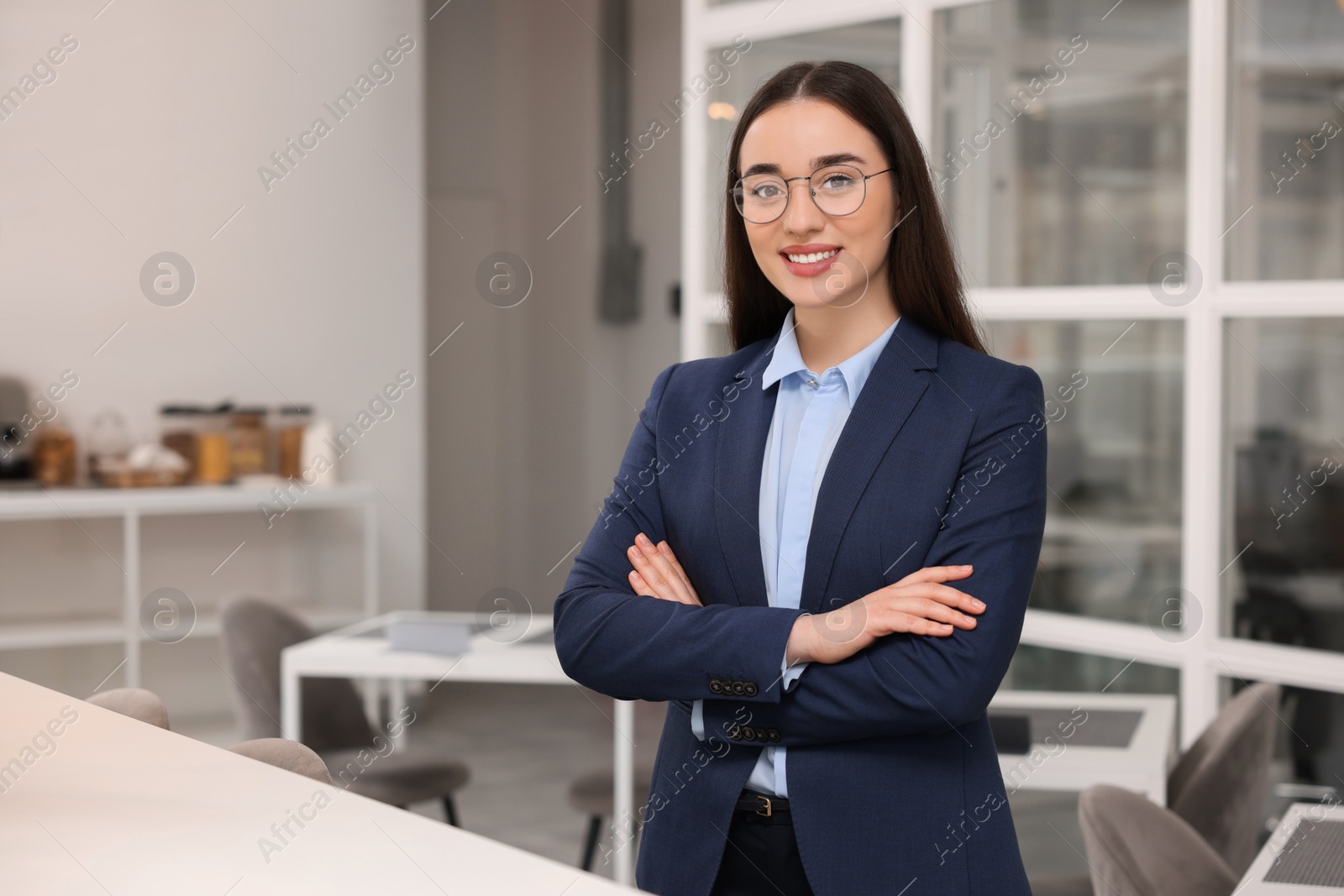 Photo of Happy real estate agent indoors. Space for text