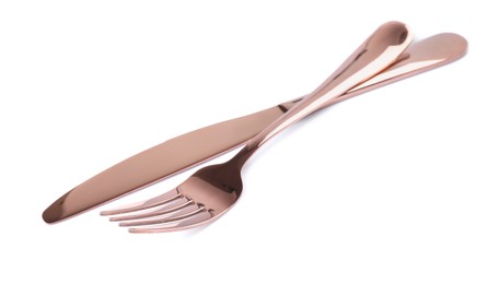 Photo of New shiny fork and knife on white background