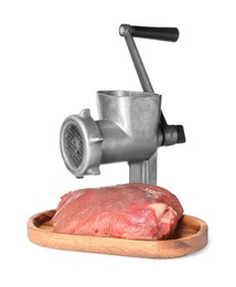 Metal meat grinder, beef and board isolated on white