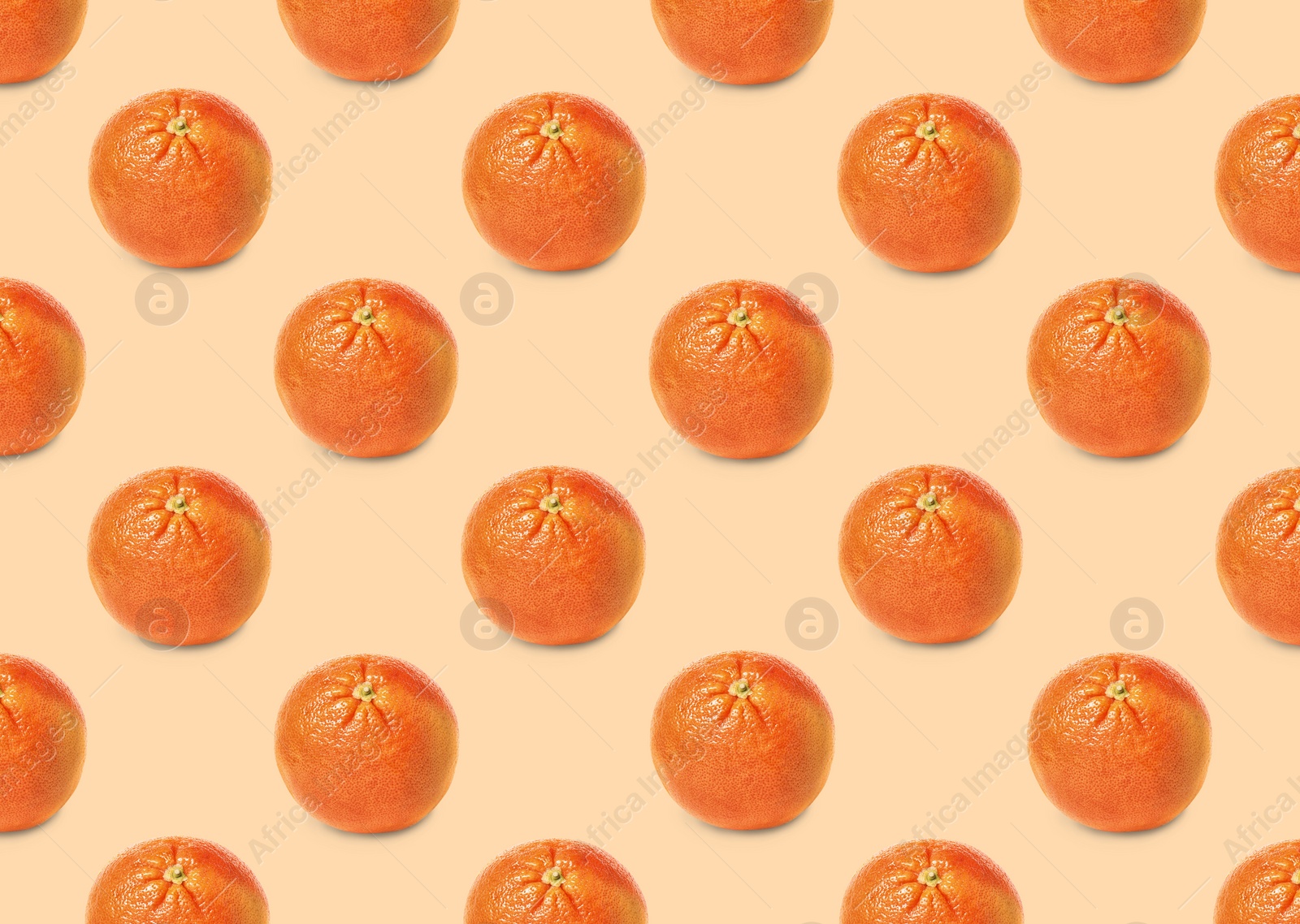 Image of Many fresh ripe grapefruits on beige background. Seamless pattern design