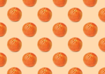 Image of Many fresh ripe grapefruits on beige background. Seamless pattern design