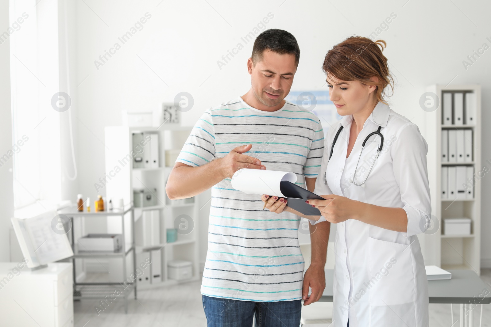 Photo of Patient having appointment with doctor in hospital