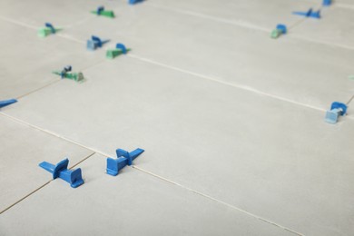 Photo of Beautiful tiles with colorful wedges as background, closeup