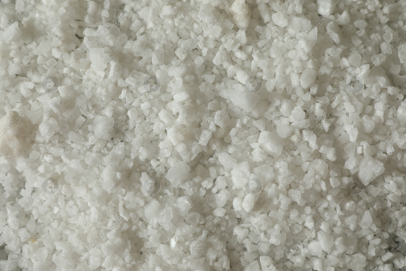 Photo of Organic sea salt as background, top view