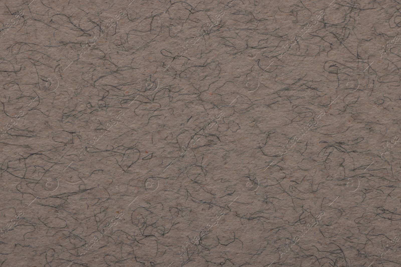 Photo of Texture of grey paper sheet as background, top view