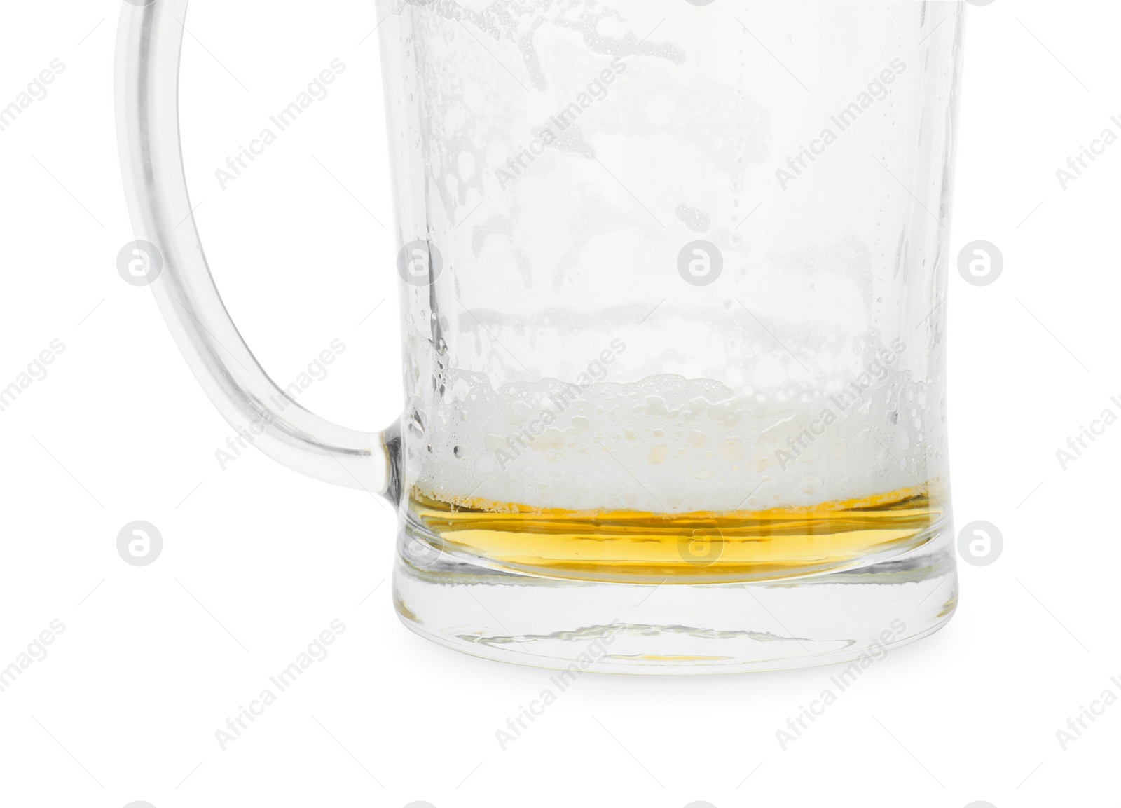 Photo of Almost empty mug of beer isolated on white