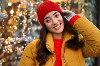 Portrait of smiling woman on blurred background. Winter time