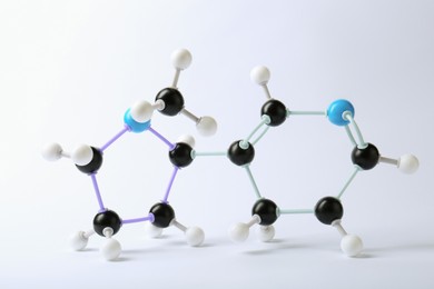Photo of Molecule of nicotine on white background. Chemical model