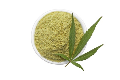 Bowl of hemp protein powder and leaf isolated on white, top view