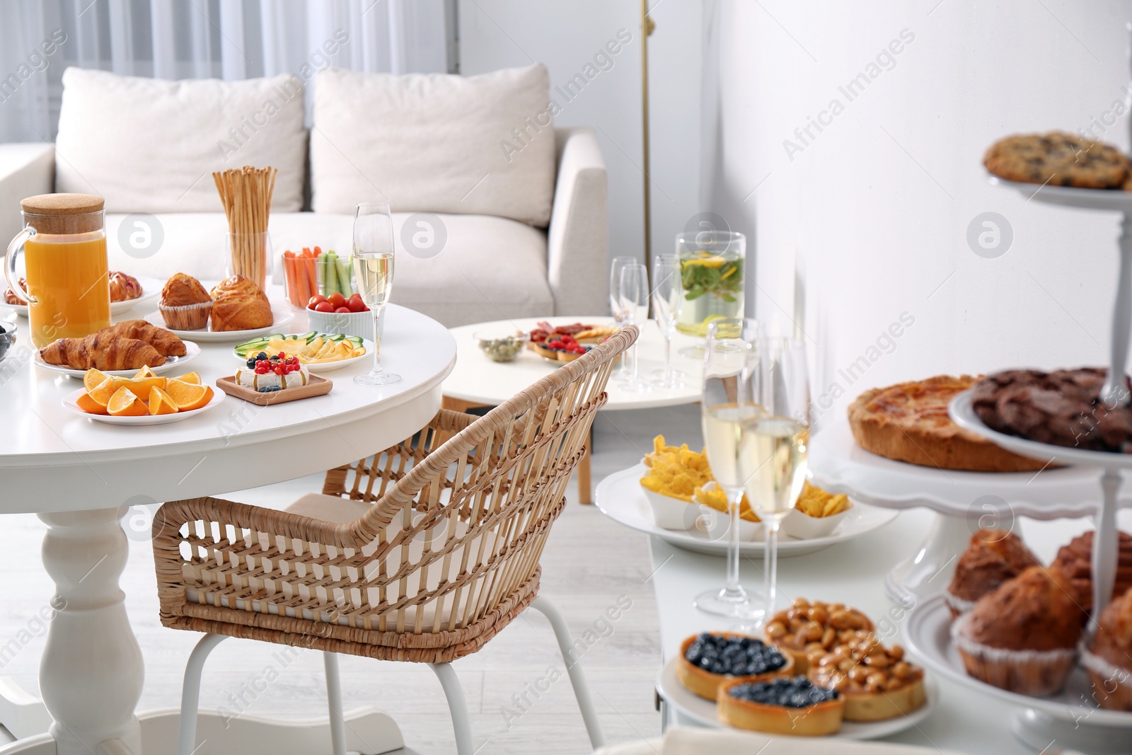 Photo of Variety of snacks served on tables indoors in buffet style