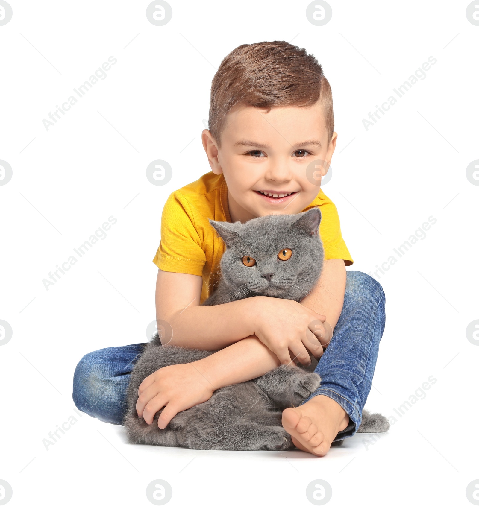 Photo of Cute little child with cat on white background