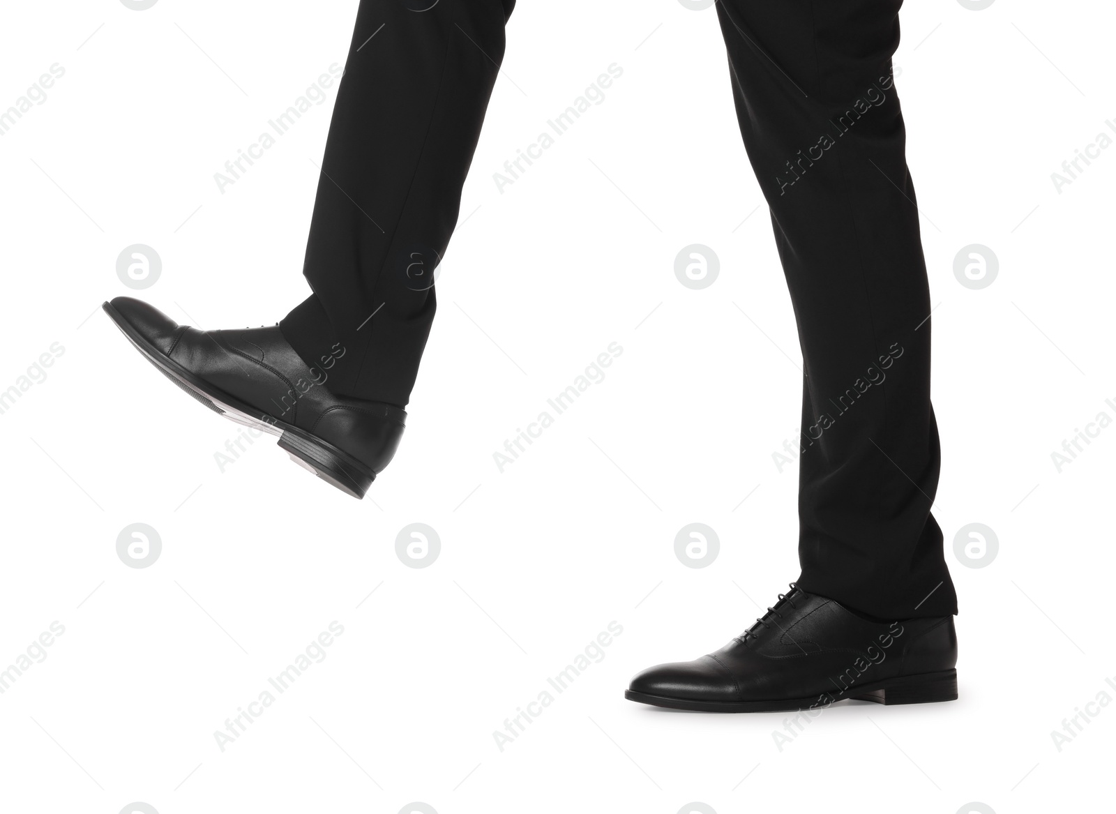 Photo of Businessman in leather shoes on white background, closeup