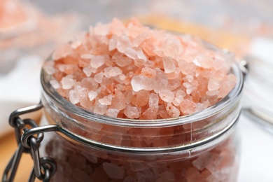 Pink himalayan salt in glass jar, closeup