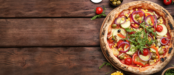 Image of Top viewhot delicious pizza on wooden table, space for text. Banner design 