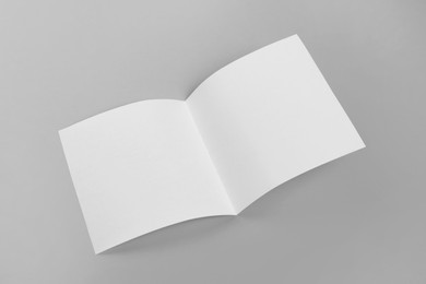 Blank paper brochure on light grey background. Mockup for design