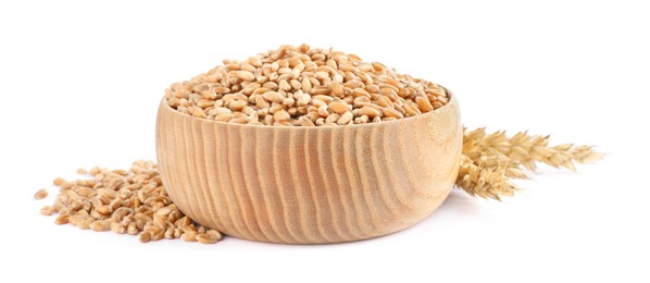 Photo of Wooden bowl with wheat grains and spikes on white background