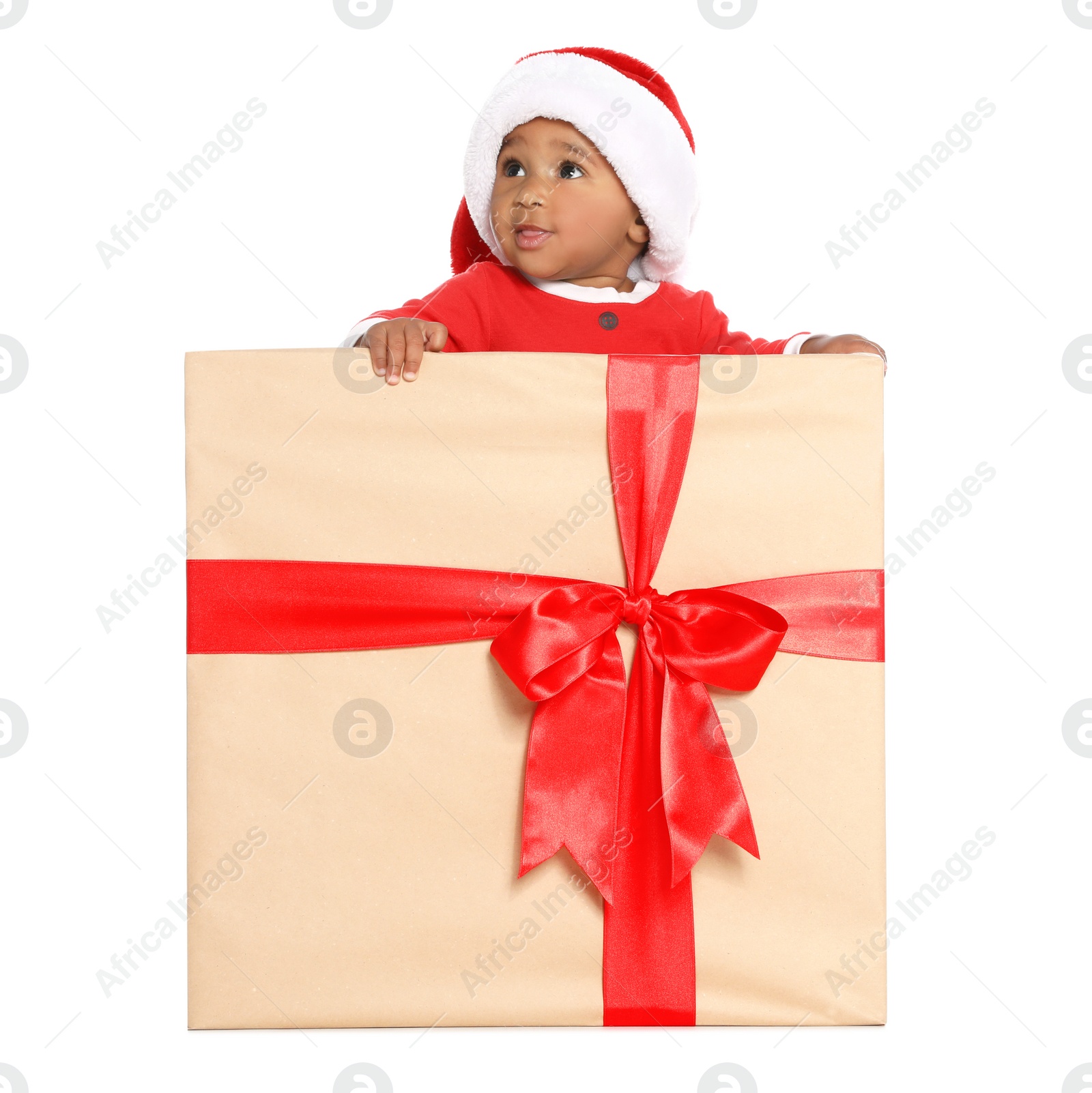 Photo of Festively dressed African-American baby in Christmas gift box on white background