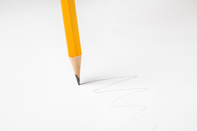 Photo of Drawing line with graphite pencil on white background. Space for text