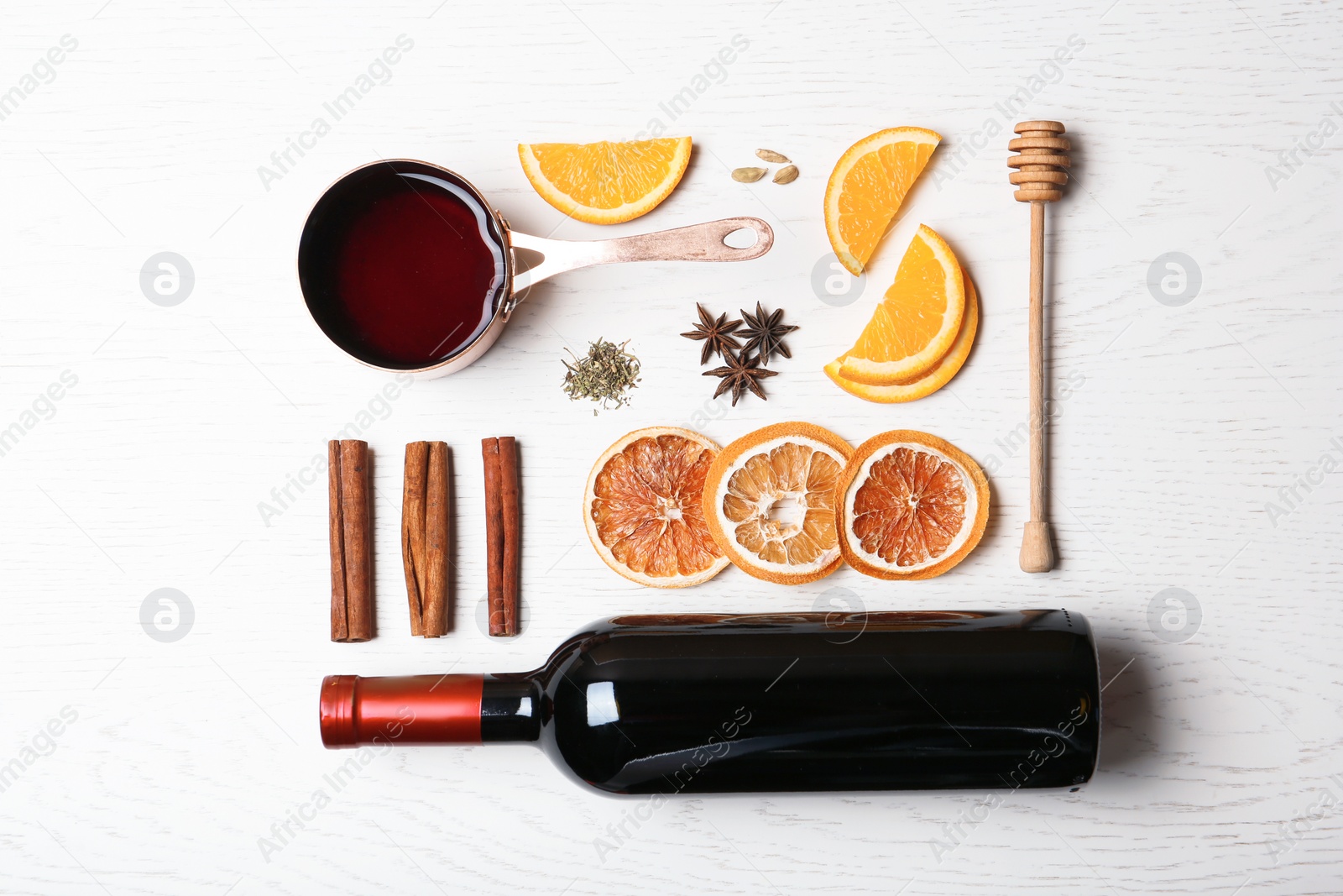 Photo of Flat lay composition with ingredients for mulled wine on white wooden background
