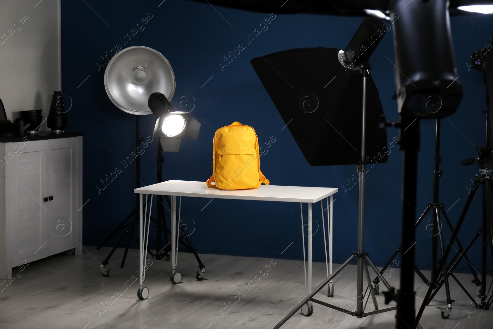 Photo of Shooting of bright backpack for product promotion in photo studio