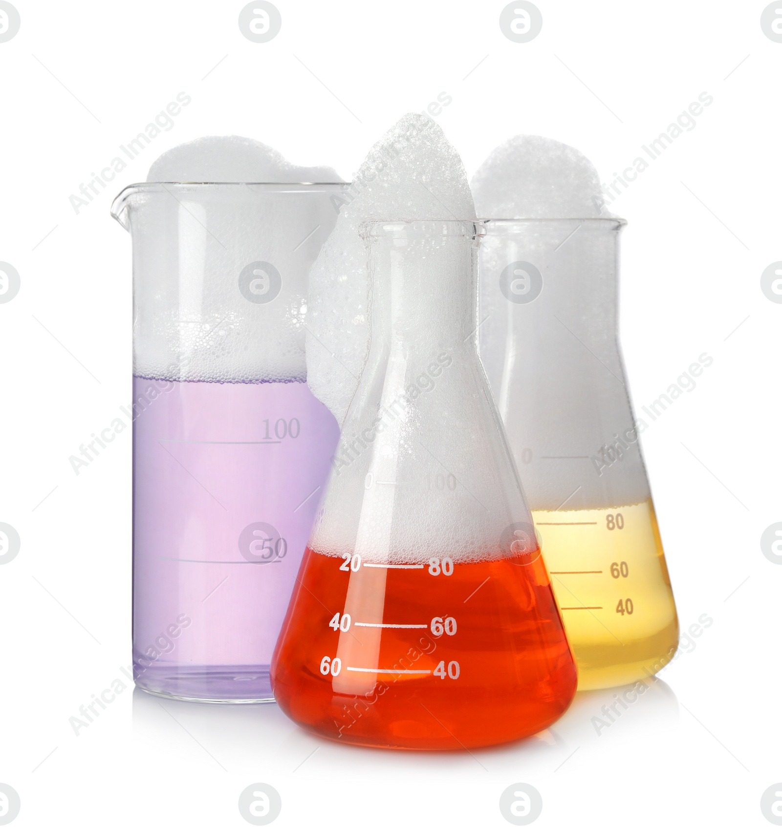 Photo of Laboratory glassware with colorful liquids isolated on white. Chemical reaction