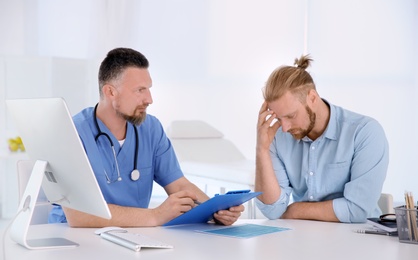 Man with health problems visiting urologist at hospital