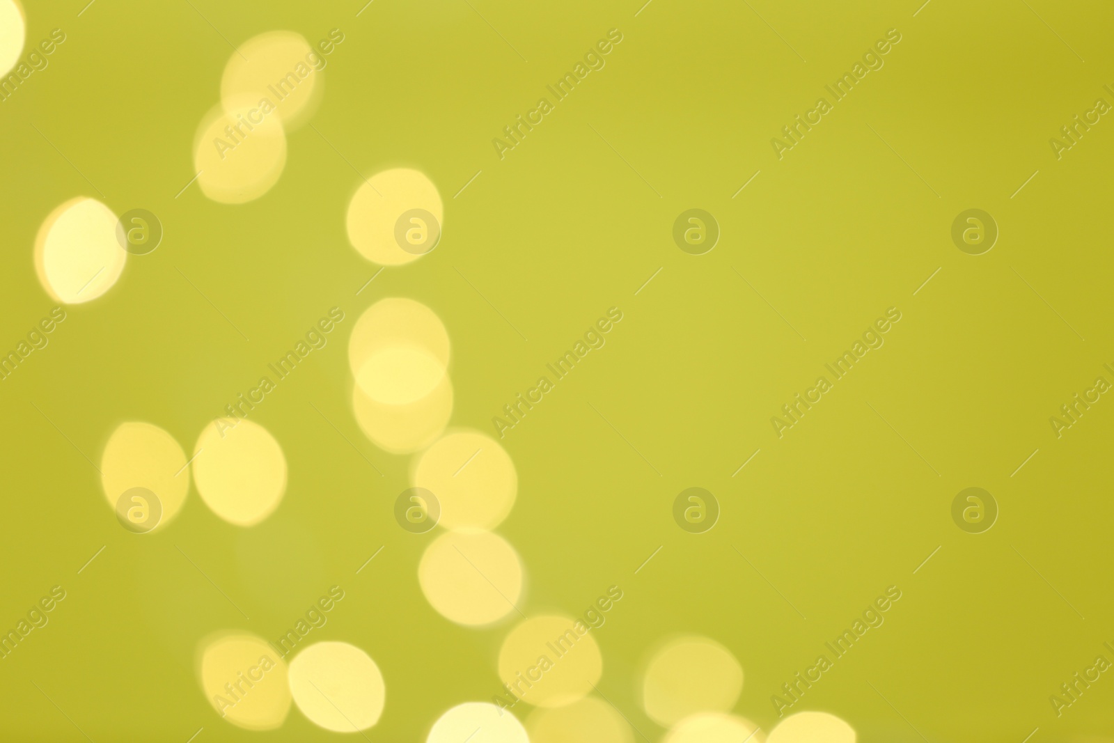 Photo of Beautiful blurred lights on color background, bokeh effect. Space for text