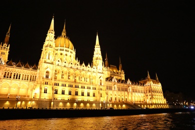 BUDAPEST, HUNGARY - APRIL 27, 2019: Beautiful night cityscape with illuminated Parliament Building