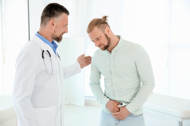 Photo of Man with health problems visiting urologist at hospital