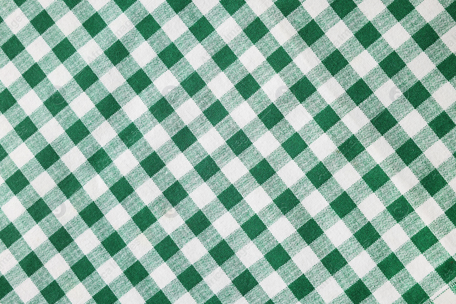 Photo of Green checkered tablecloth as background, top view