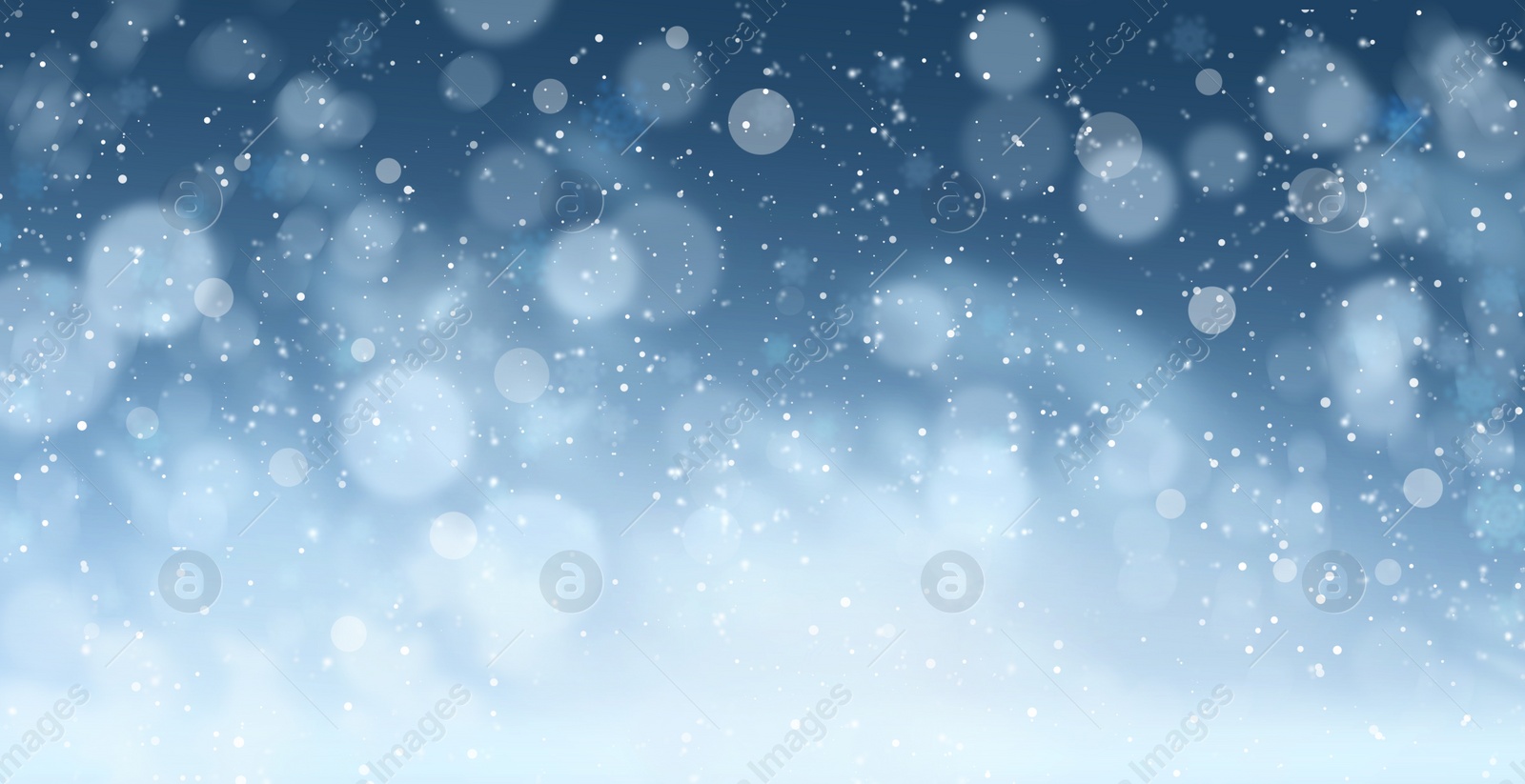 Image of Abstract snowfall on blue background, bokeh effect. Banner design 