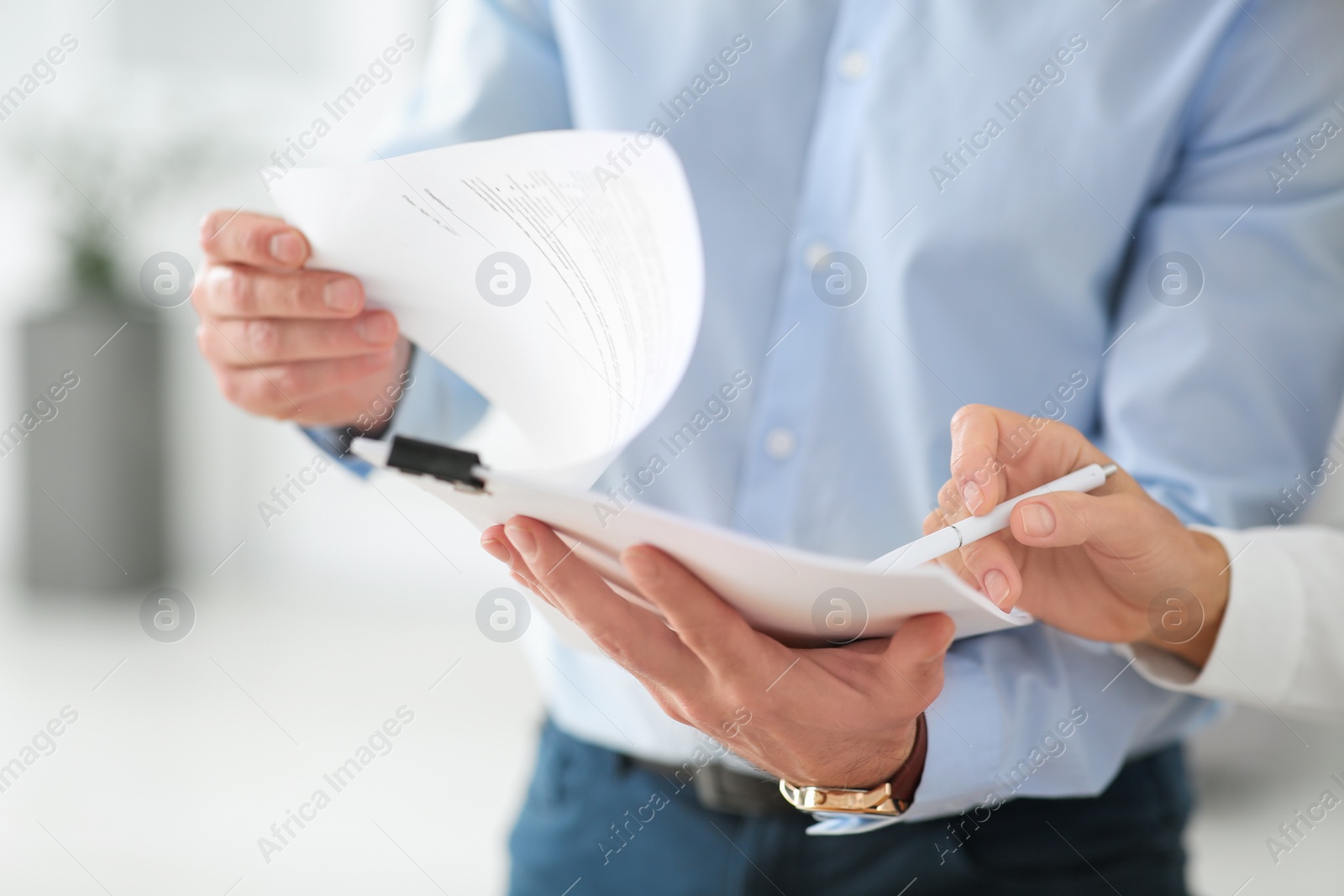 Photo of Businesspeople working with documents in office, closeup