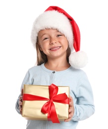 Happy little child in Santa hat with gift box on white background. Christmas celebration